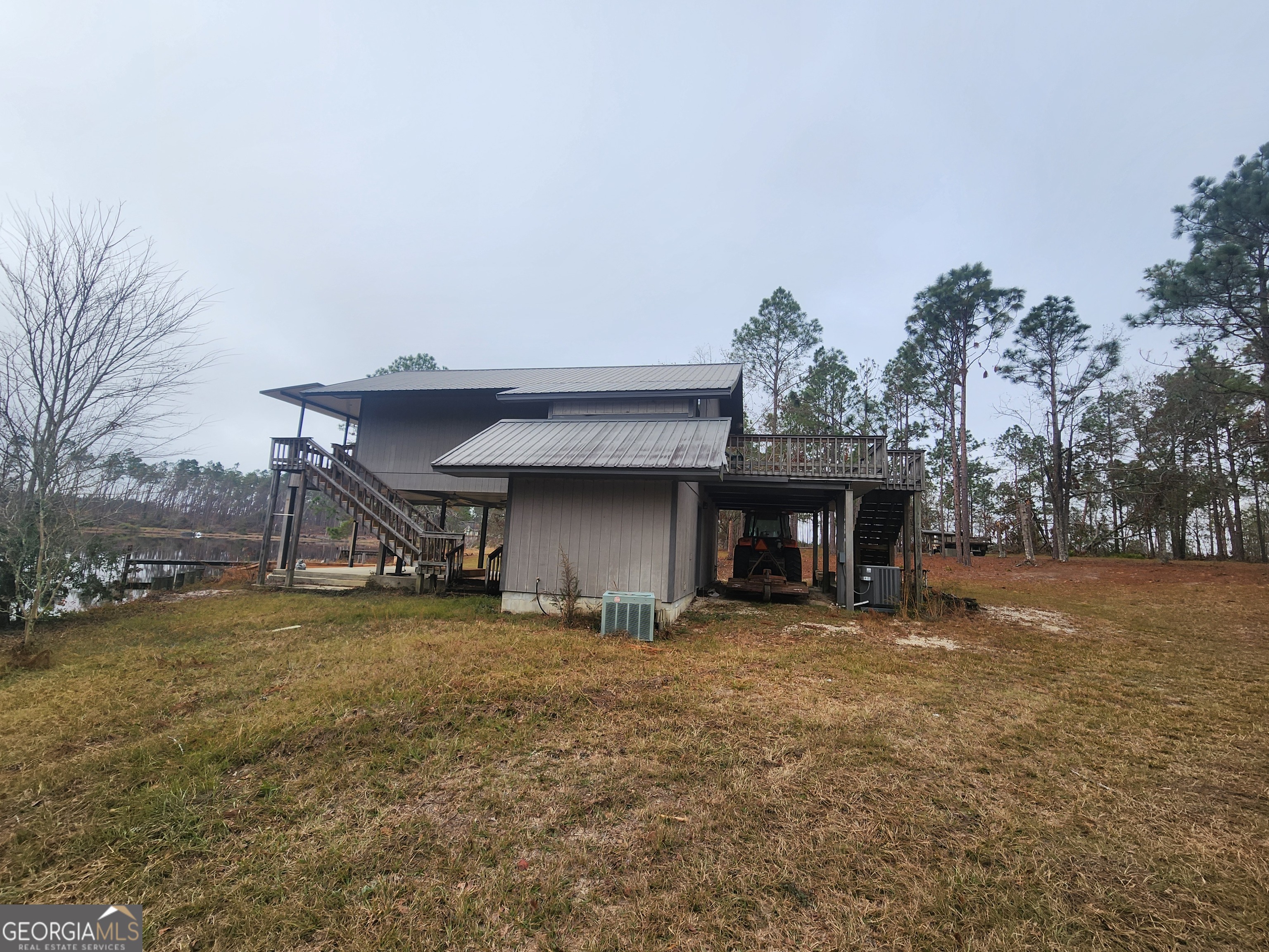 0 Hammond Powell Road Hazlehurst, GA 31539 - Photo 7 of 45 a view of a house with a yard and garage