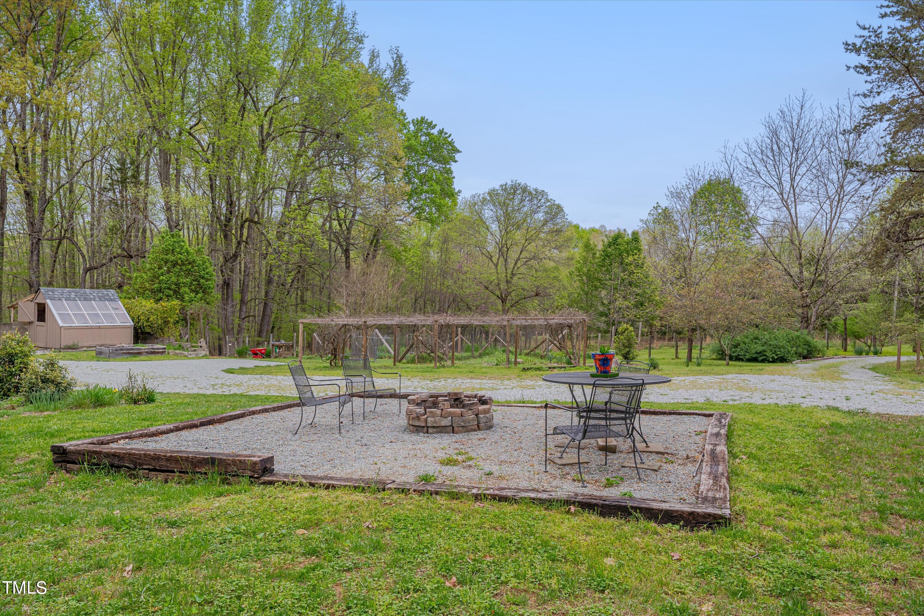 377 Potluck Farm Road Rougemont, NC 27572 - Photo 37 of 54 Large custom fire pit added in 2022