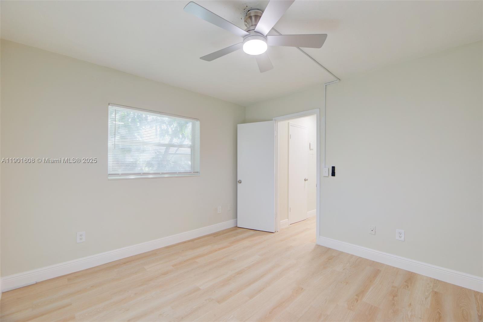 1880 Northwest 59th Way Sunrise, FL 33313 - Photo 15 of 27 a view of an empty room with a window