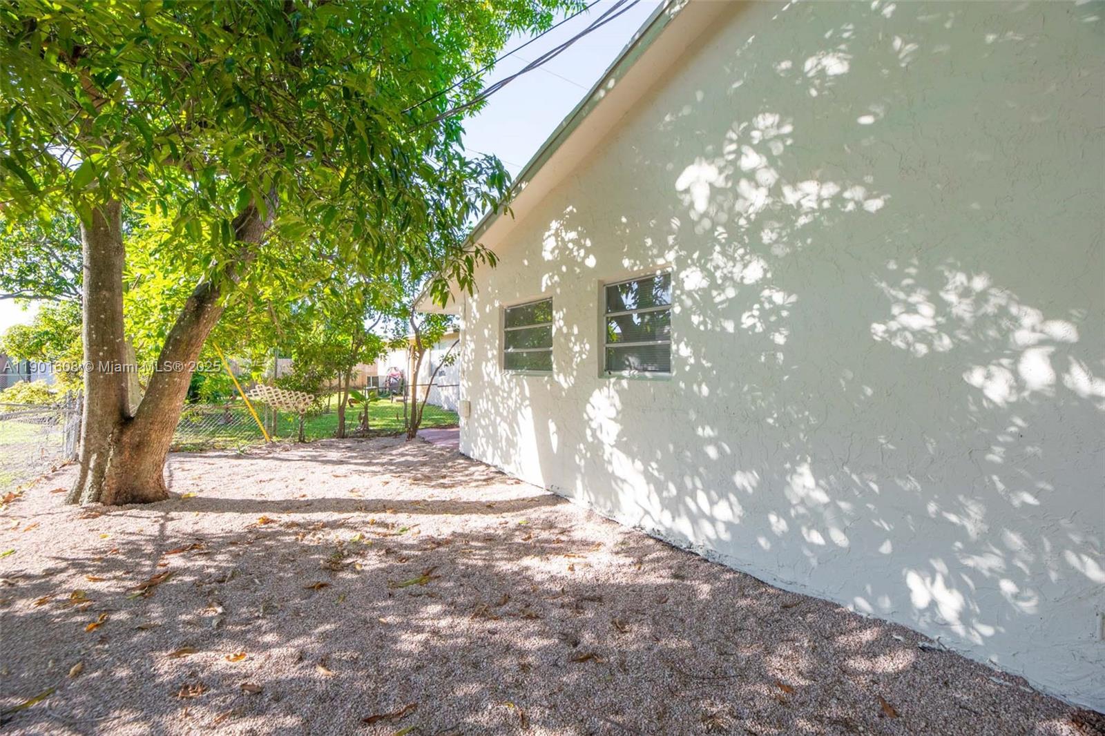 1880 Northwest 59th Way Sunrise, FL 33313 - Photo 22 of 27 a view of a house with a tree s