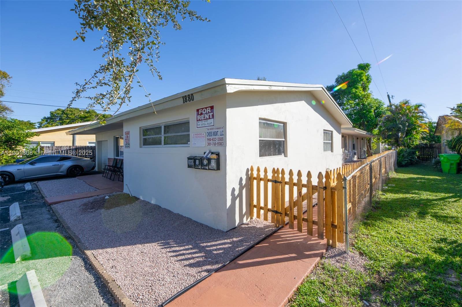 1880 Northwest 59th Way Sunrise, FL 33313 - Photo 24 of 27 a view of a house with a yard