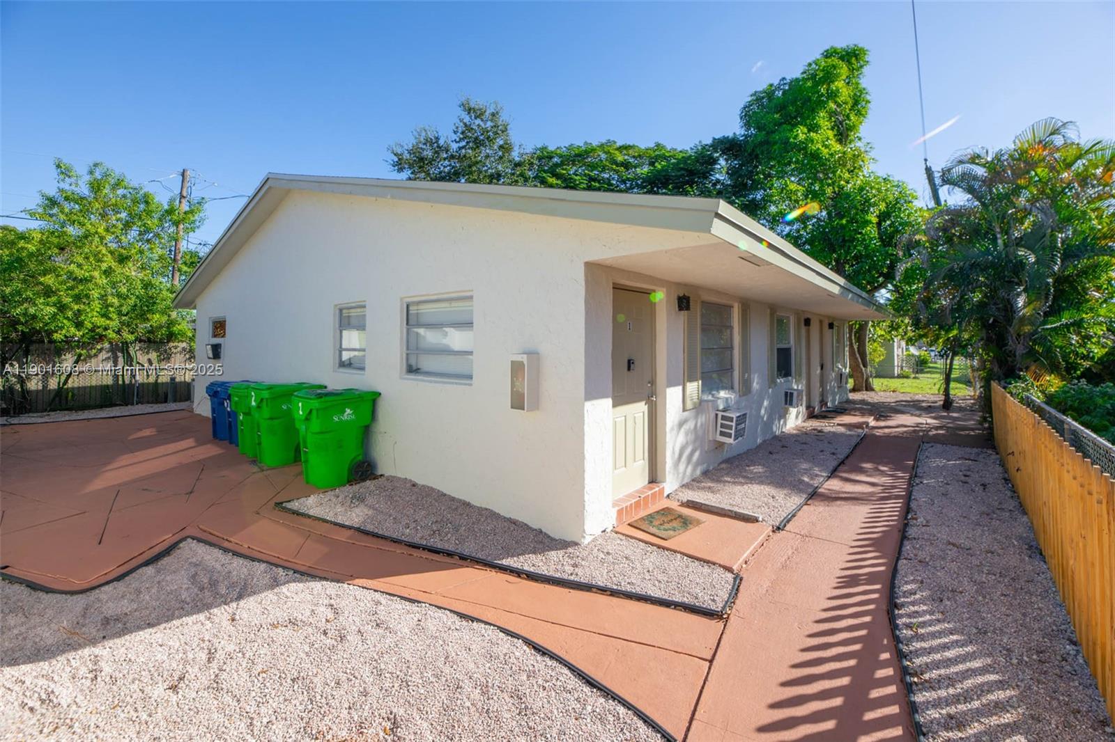 1880 Northwest 59th Way Sunrise, FL 33313 - Photo 27 of 27 a front view of a house with a yard