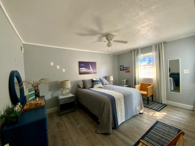 a bedroom with bed and window