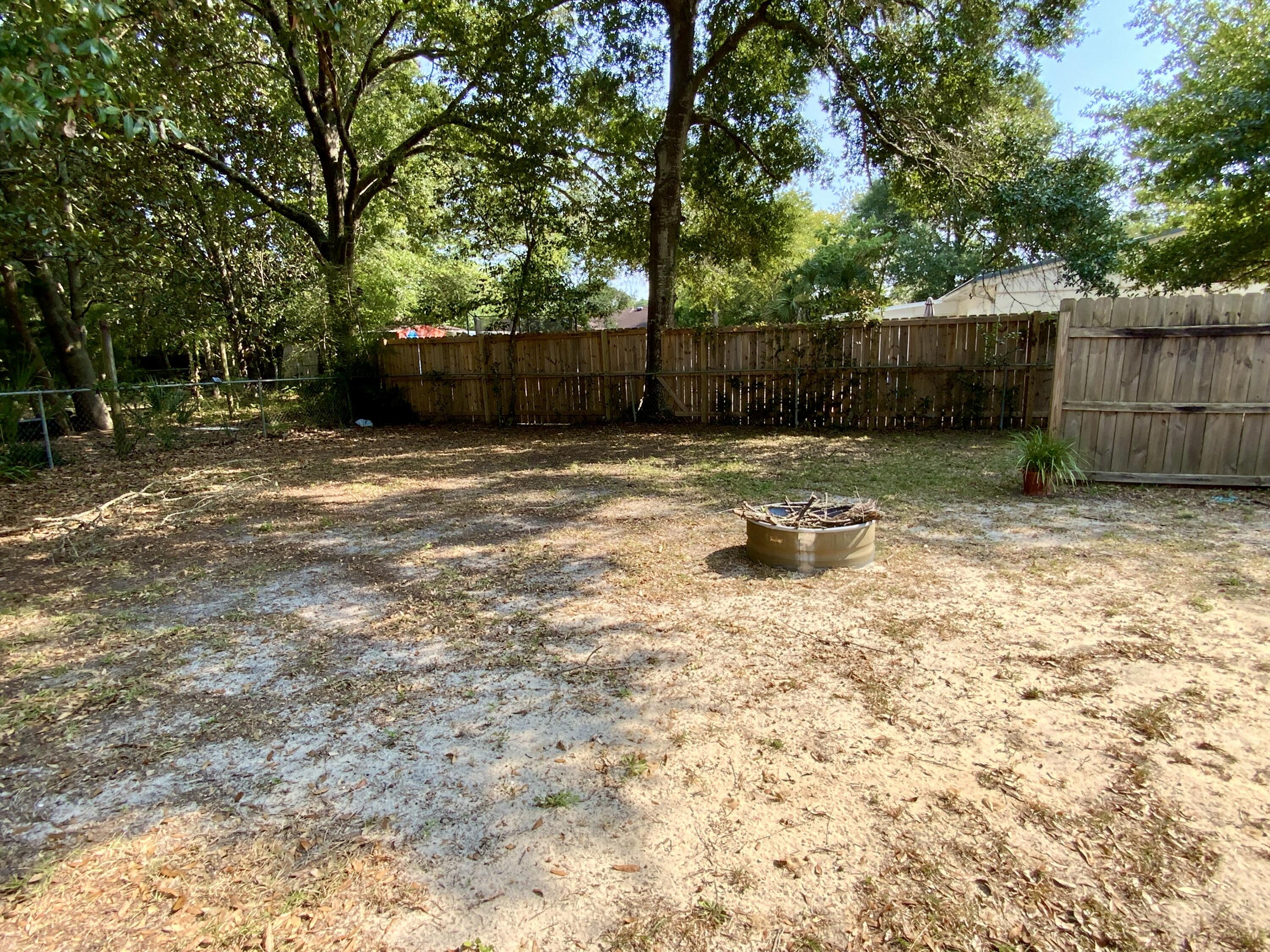 401 Gerold Street Fort Walton Beach, FL 32547 - Photo 17 of 20 a backyard of a house with lots of green space