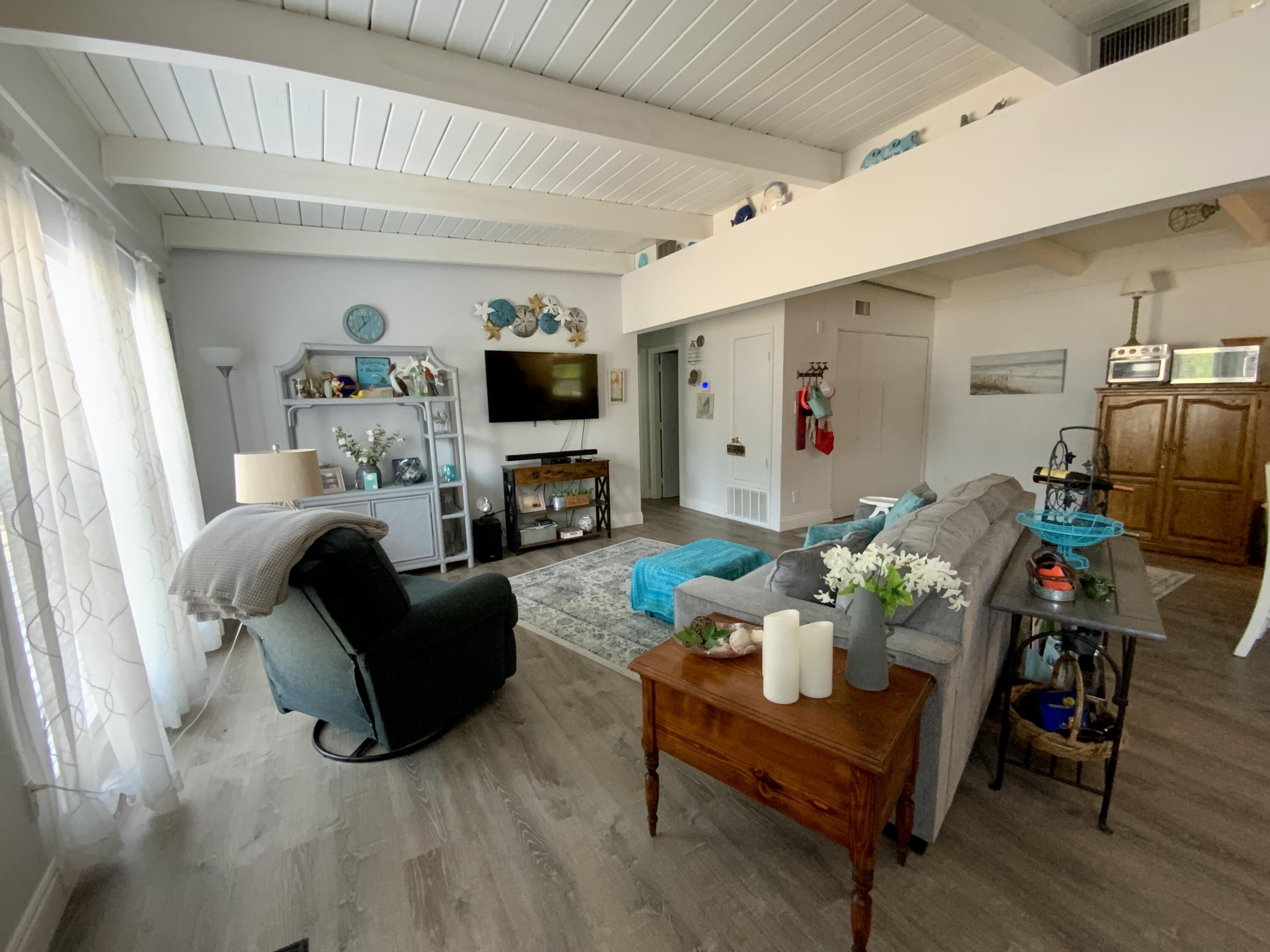401 Gerold Street Fort Walton Beach, FL 32547 - Photo 3 of 20 a living room with furniture fireplace and a flat screen tv