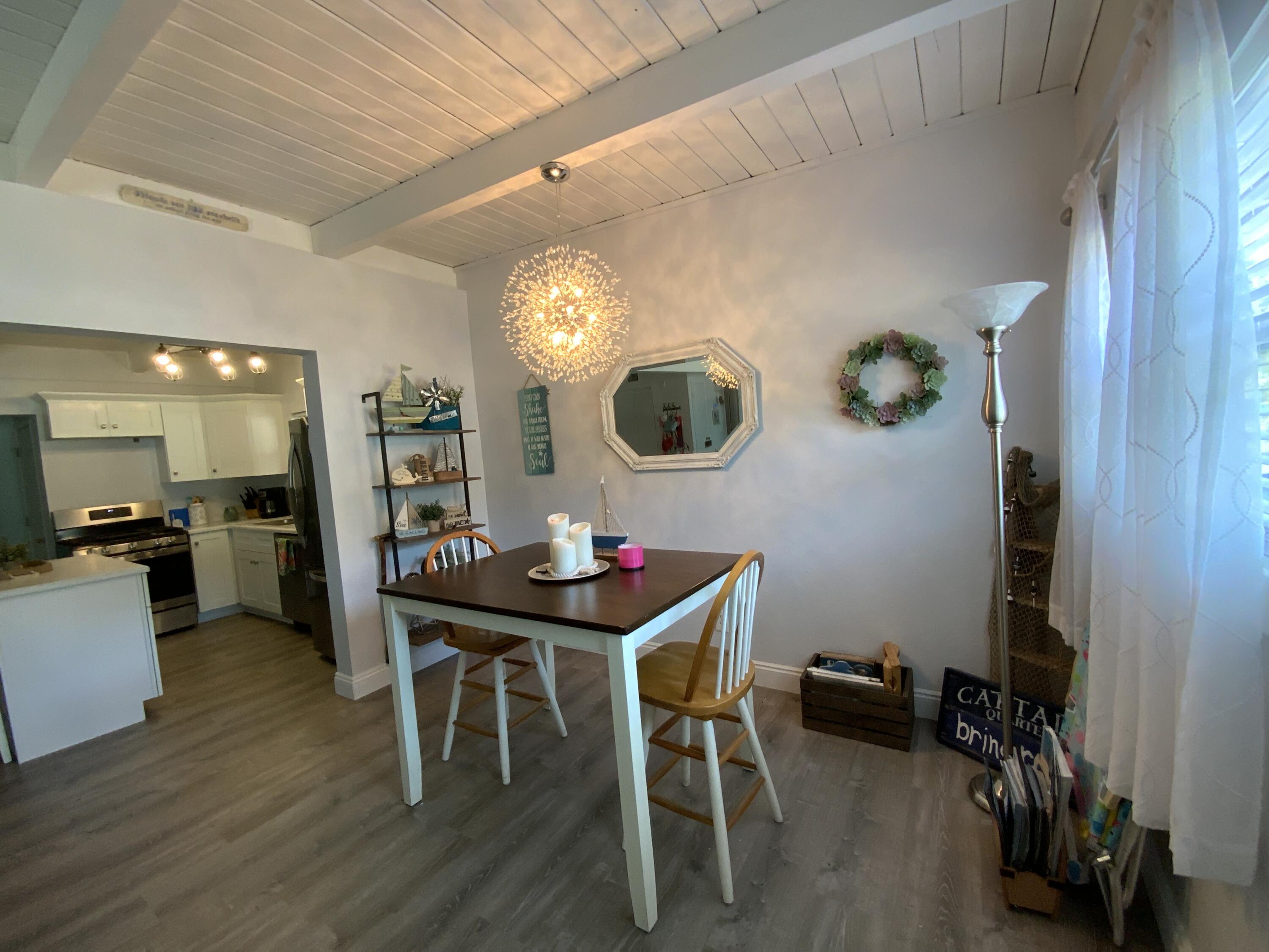 401 Gerold Street Fort Walton Beach, FL 32547 - Photo 10 of 20 a view of a dining room with furniture and wooden floor