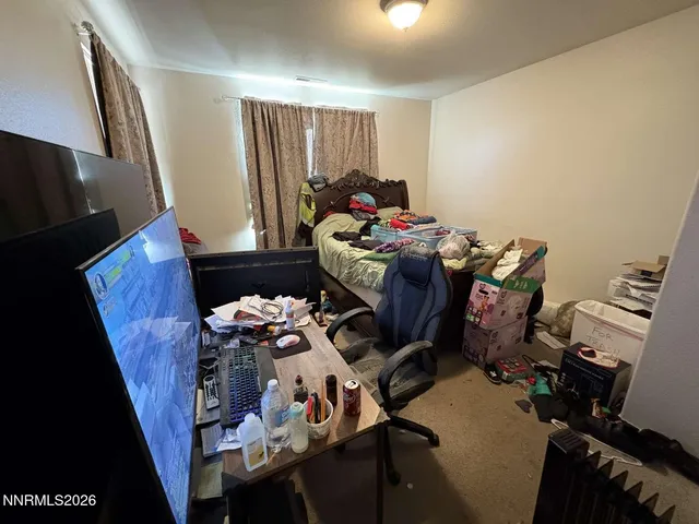 a bed room with a bed furniture and a window