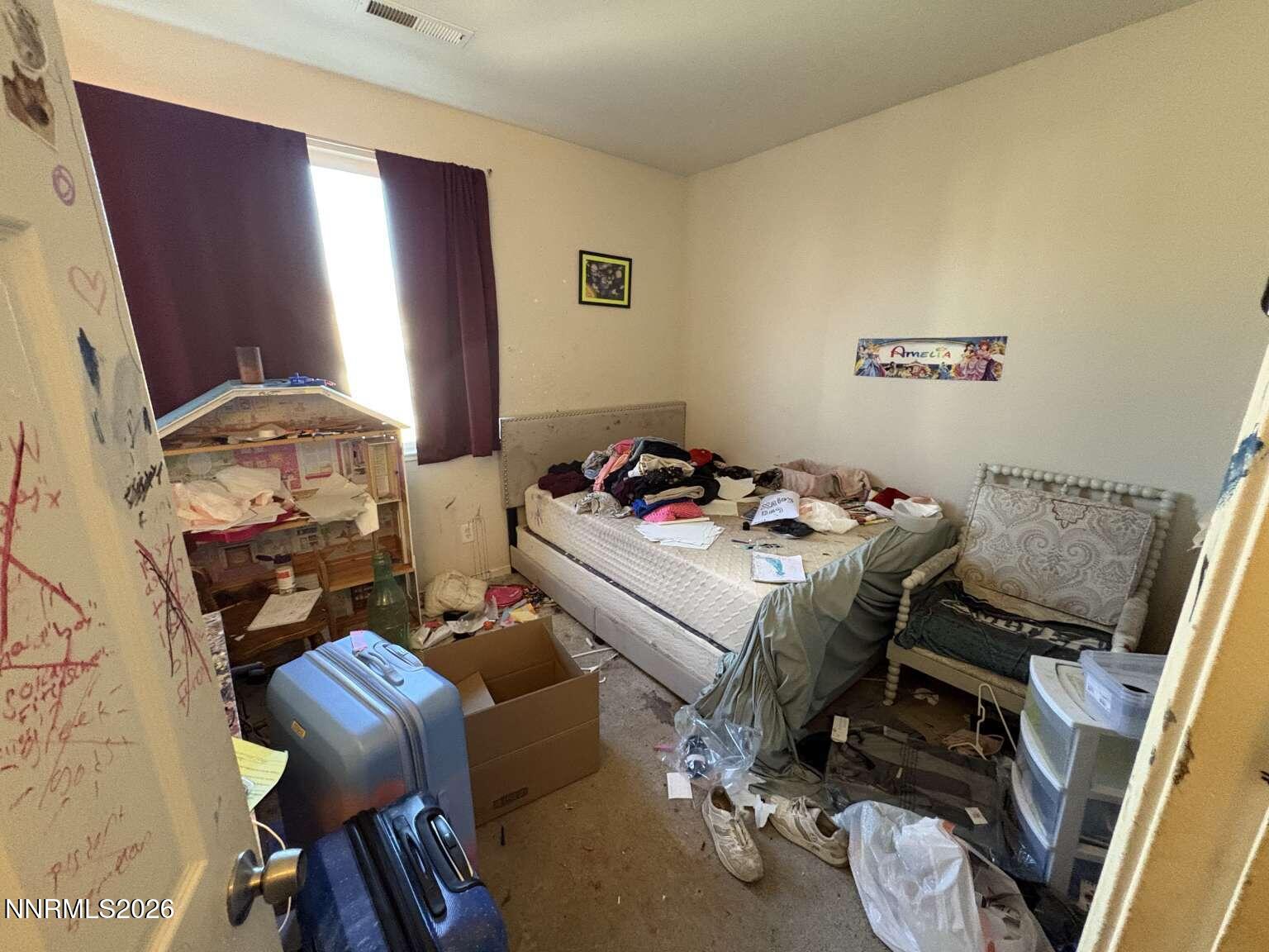 20888 White Rock Drive Reno, NV 89508 - Photo 15 of 18 a bedroom with a bed and wooden floor