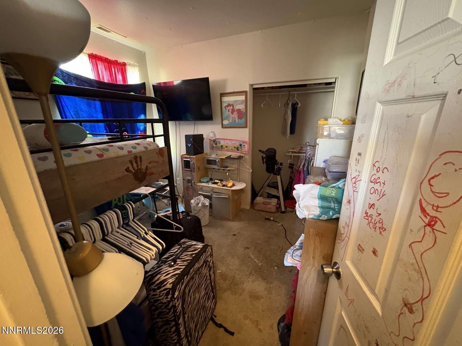 20888 White Rock Drive Reno, NV 89508 - Photo 16 of 18 a view of a living room with furniture and a flat screen tv