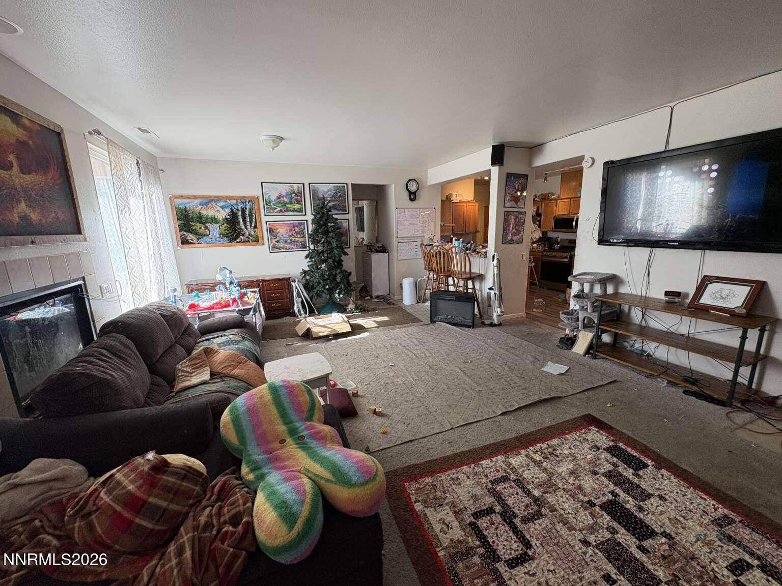 20888 White Rock Drive Reno, NV 89508 - Photo 9 of 18 a living room with furniture and a flat screen tv