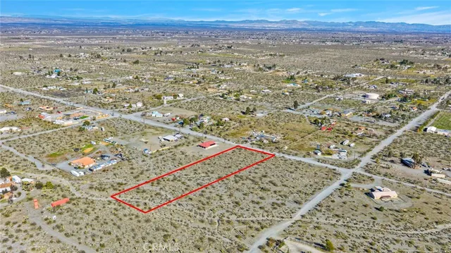 a view of a city with mountains in the background