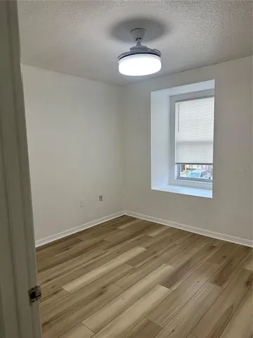 a view of an empty room and window