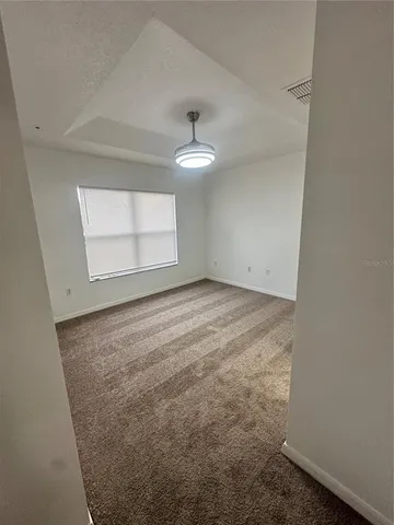 a bathroom with a granite countertop toilet a sink and a bathtub