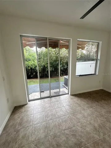 a view of an empty room with windows