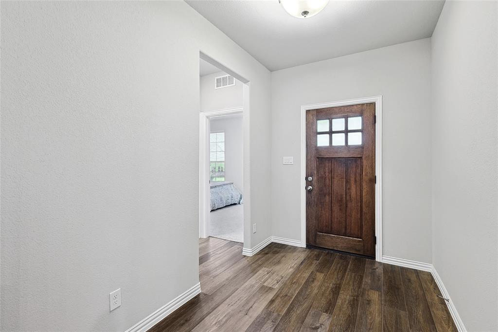 808 Feather Edge Drive Springtown, TX 76082 - Photo 6 of 40 wooden floor in an empty room
