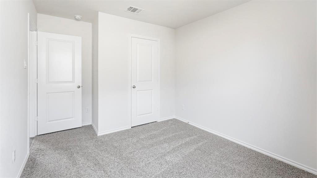 3519 Spring Time Street Forney, TX 75126 - Photo 15 of 37 Interior room featuring light gray carpet, white walls, and bright white trim