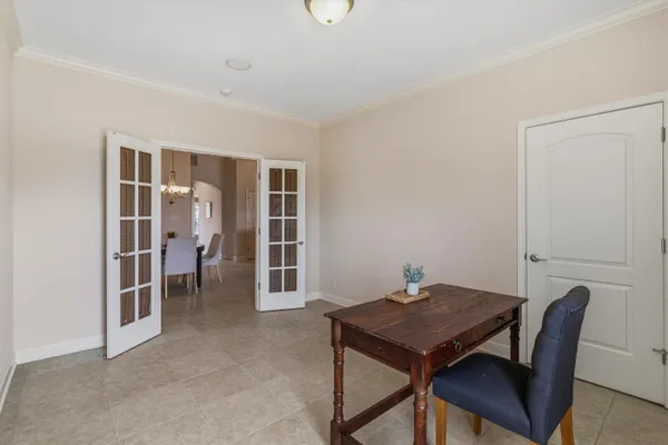 a view of a room with a ceiling fan and closet