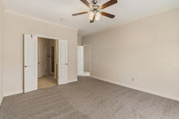 a bedroom with bed and a window