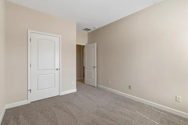 a kitchen with stainless steel appliances granite countertop a sink and a refrigerator