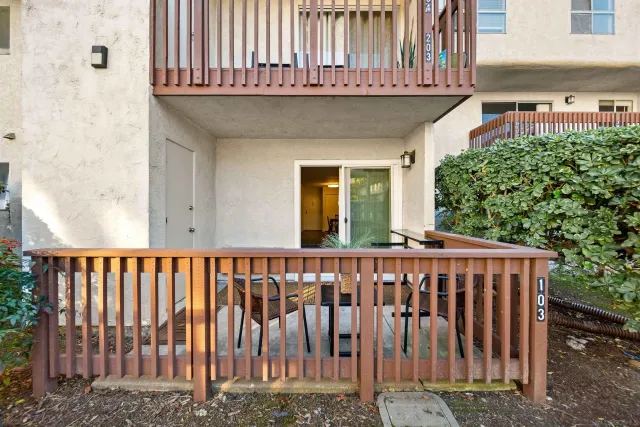 a view of a house with wooden fence