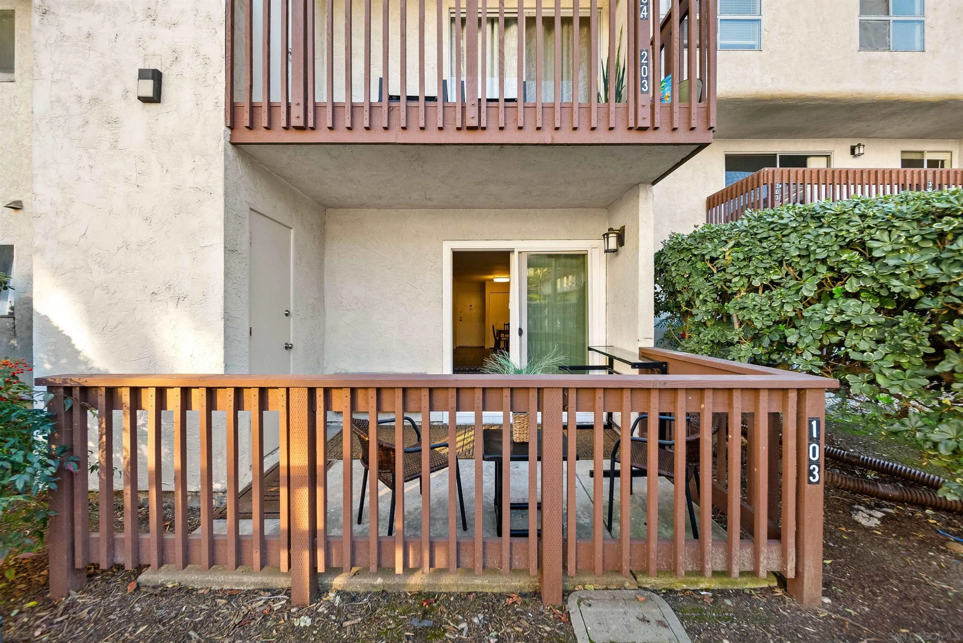 6191 Rancho Mission Road, Unit 103 San Diego, CA 92108 - Photo 14 of 28 a view of a house with wooden fence