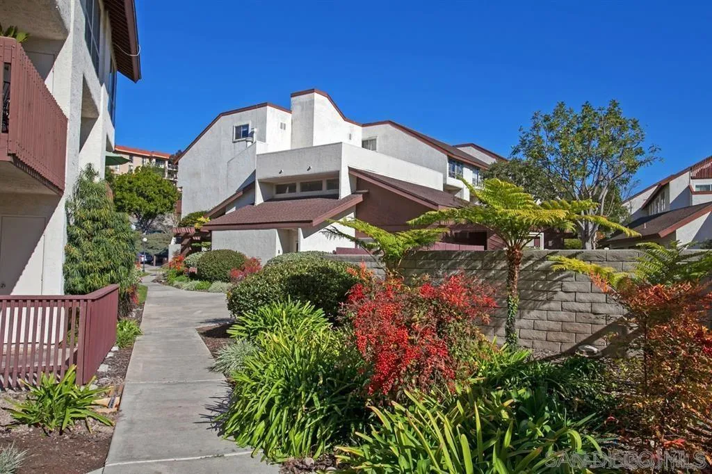 6191 Rancho Mission Road, Unit 103 San Diego, CA 92108 - Photo 15 of 28 an aerial view of a house with a yard and garden