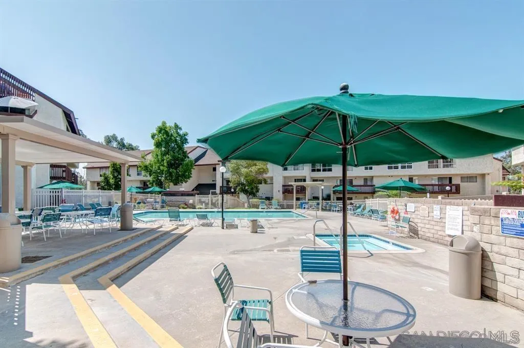 6191 Rancho Mission Road, Unit 103 San Diego, CA 92108 - Photo 18 of 28 a outdoor space with furniture and umbrella