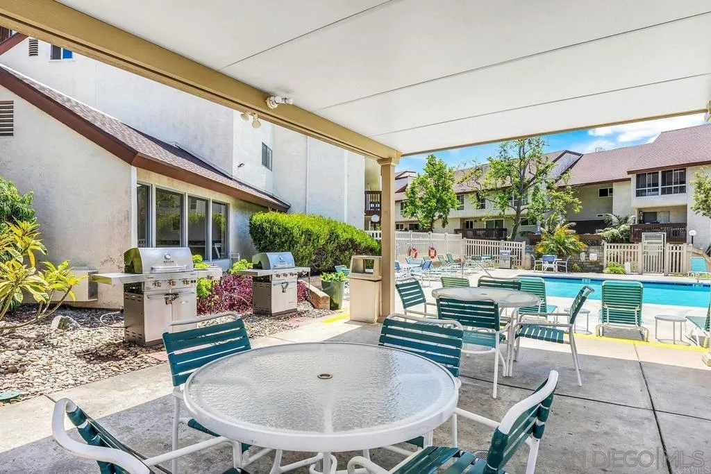 6191 Rancho Mission Road, Unit 103 San Diego, CA 92108 - Photo 19 of 28 a building outdoor space with patio furniture and potted plants