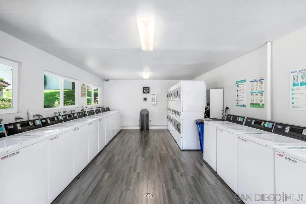 6191 Rancho Mission Road, Unit 103 San Diego, CA 92108 - Photo 21 of 28 a kitchen with a sink and wooden floor