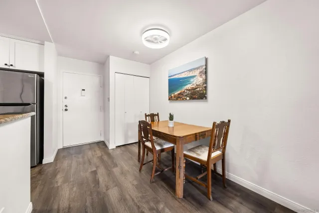 a view of a dining room with furniture and wooden floor