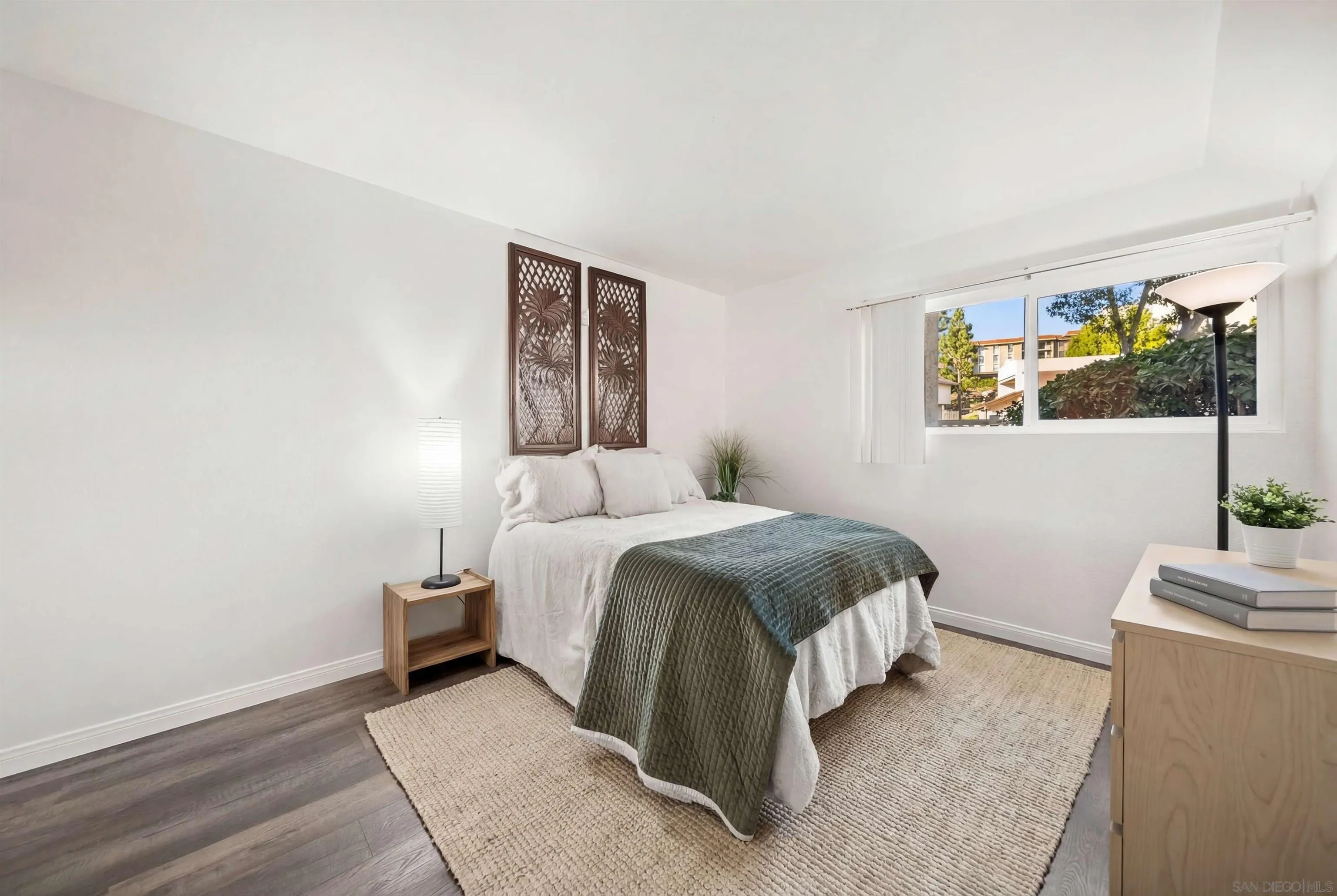 6191 Rancho Mission Road, Unit 103 San Diego, CA 92108 - Photo 7 of 28 a spacious bedroom with a bed and a window
