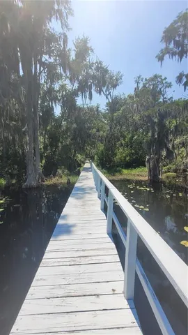 a view of a balcony with wooden floor
