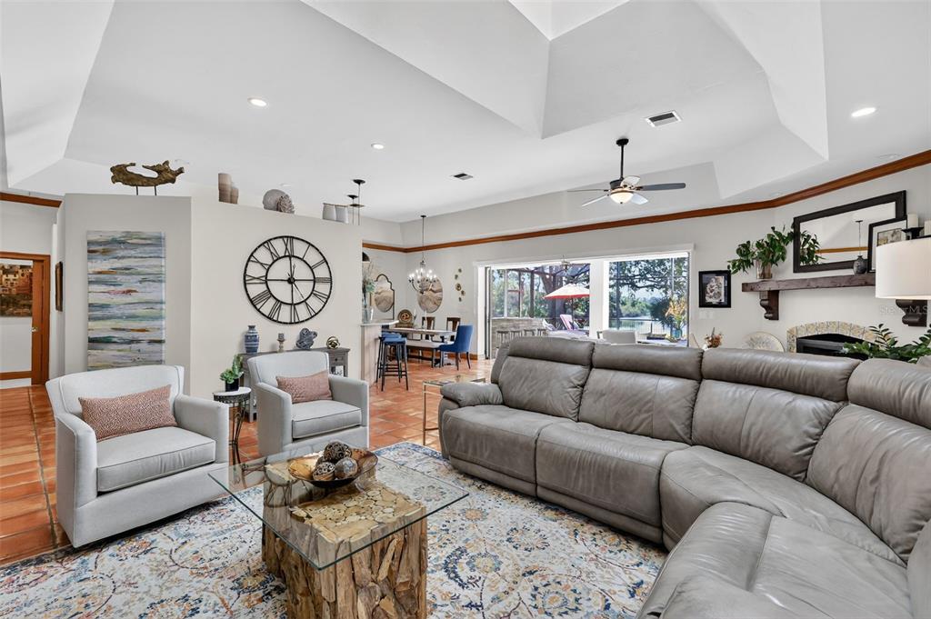 16238 East Shirley Shores Road Tavares, FL 32778 - Photo 11 of 48 a living room with furniture kitchen view and a window