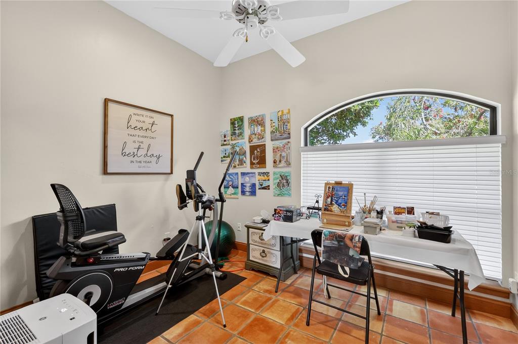 16238 East Shirley Shores Road Tavares, FL 32778 - Photo 27 of 48 a view of a workspace with furniture and a window