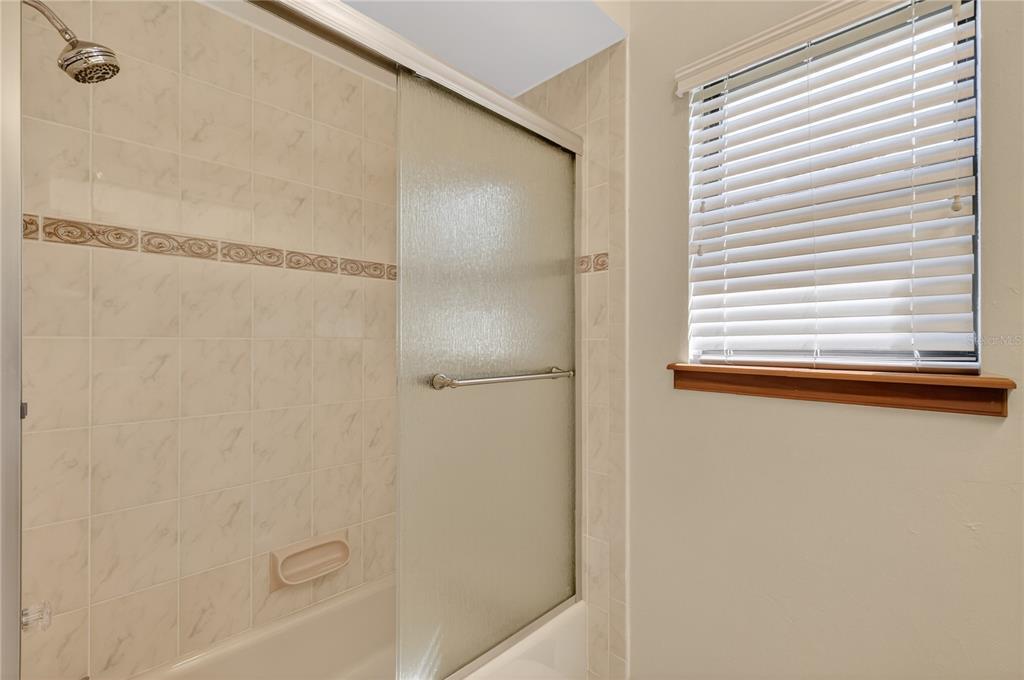 16238 East Shirley Shores Road Tavares, FL 32778 - Photo 31 of 48 a bathroom with a bathtub
