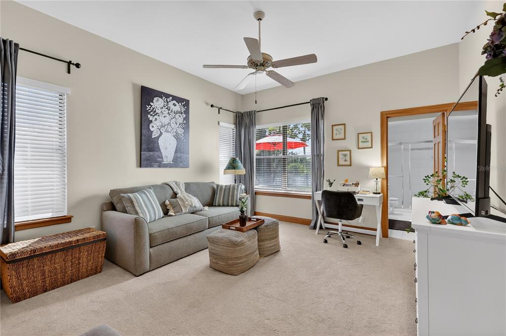 16238 East Shirley Shores Road Tavares, FL 32778 - Photo 32 of 48 a living room with furniture and a flat screen tv