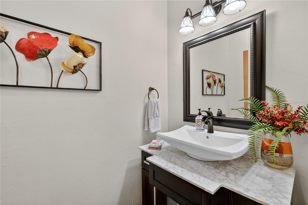 16238 East Shirley Shores Road Tavares, FL 32778 - Photo 34 of 48 a bathroom with a sink and a mirror