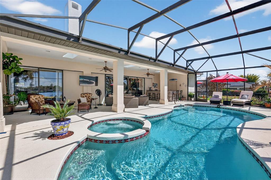 16238 East Shirley Shores Road Tavares, FL 32778 - Photo 39 of 48 a view of a chairs and table in a patio