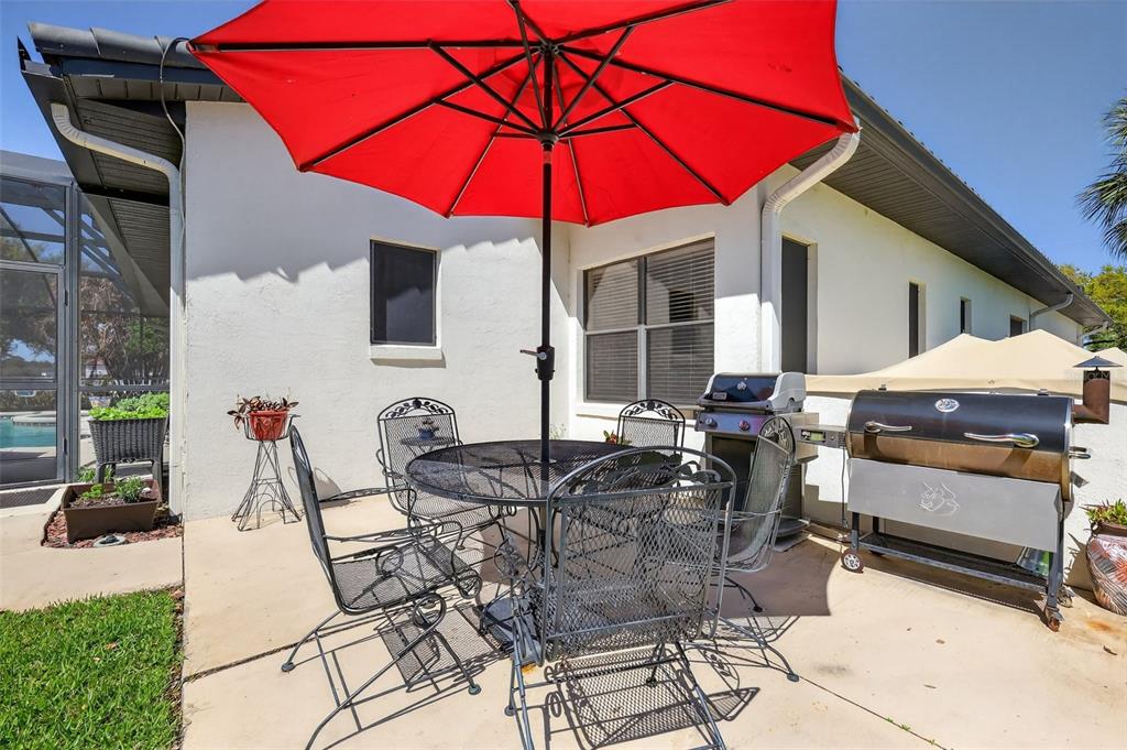 16238 East Shirley Shores Road Tavares, FL 32778 - Photo 40 of 48 a view of a dinning tables and chairs in the patio