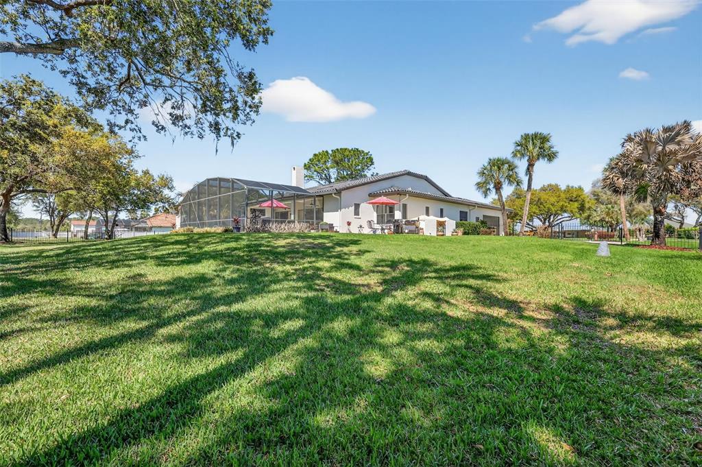 16238 East Shirley Shores Road Tavares, FL 32778 - Photo 41 of 48 a house view with a garden space