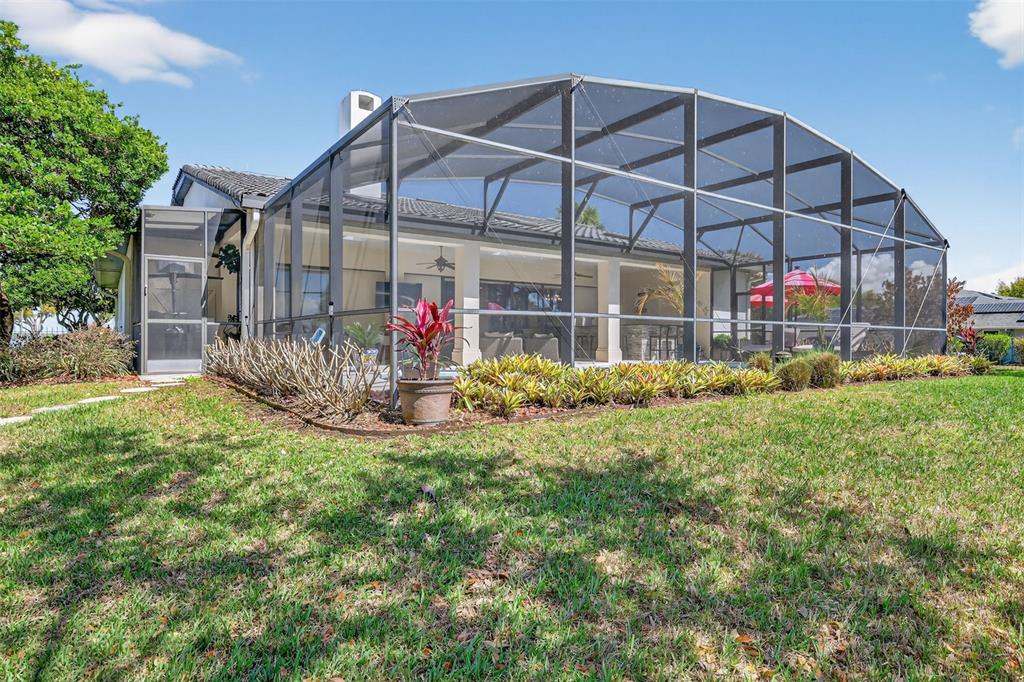 16238 East Shirley Shores Road Tavares, FL 32778 - Photo 42 of 48 a view of a house with a yard and sitting area