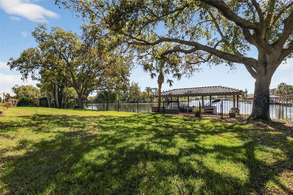 16238 East Shirley Shores Road Tavares, FL 32778 - Photo 43 of 48 a view of a house with a yard