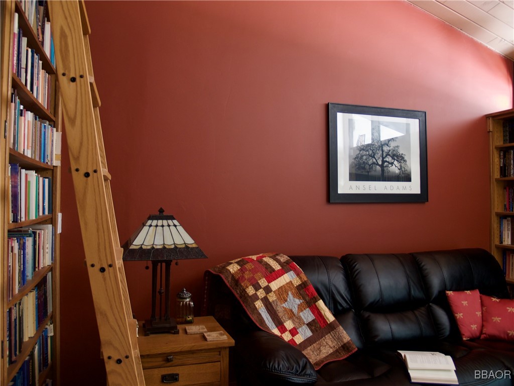872 Sierra Vista Drive, Unit 9 Twin Peaks, CA 92391 - Photo 11 of 23 a living room with furniture and a piano