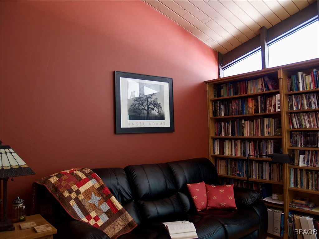 872 Sierra Vista Drive, Unit 9 Twin Peaks, CA 92391 - Photo 12 of 23 a living room with furniture and a book shelf