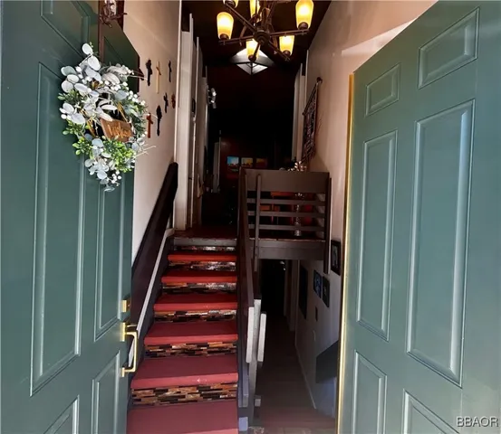 a living room with furniture a fireplace and a window
