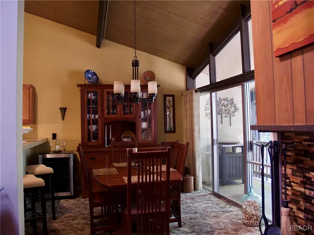 a living room with furniture a fireplace and a window