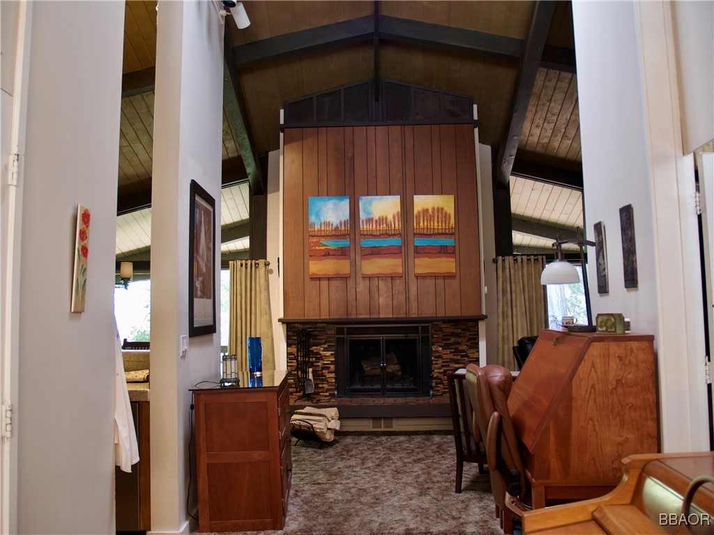 872 Sierra Vista Drive, Unit 9 Twin Peaks, CA 92391 - Photo 10 of 23 a living room with furniture a fireplace and a window
