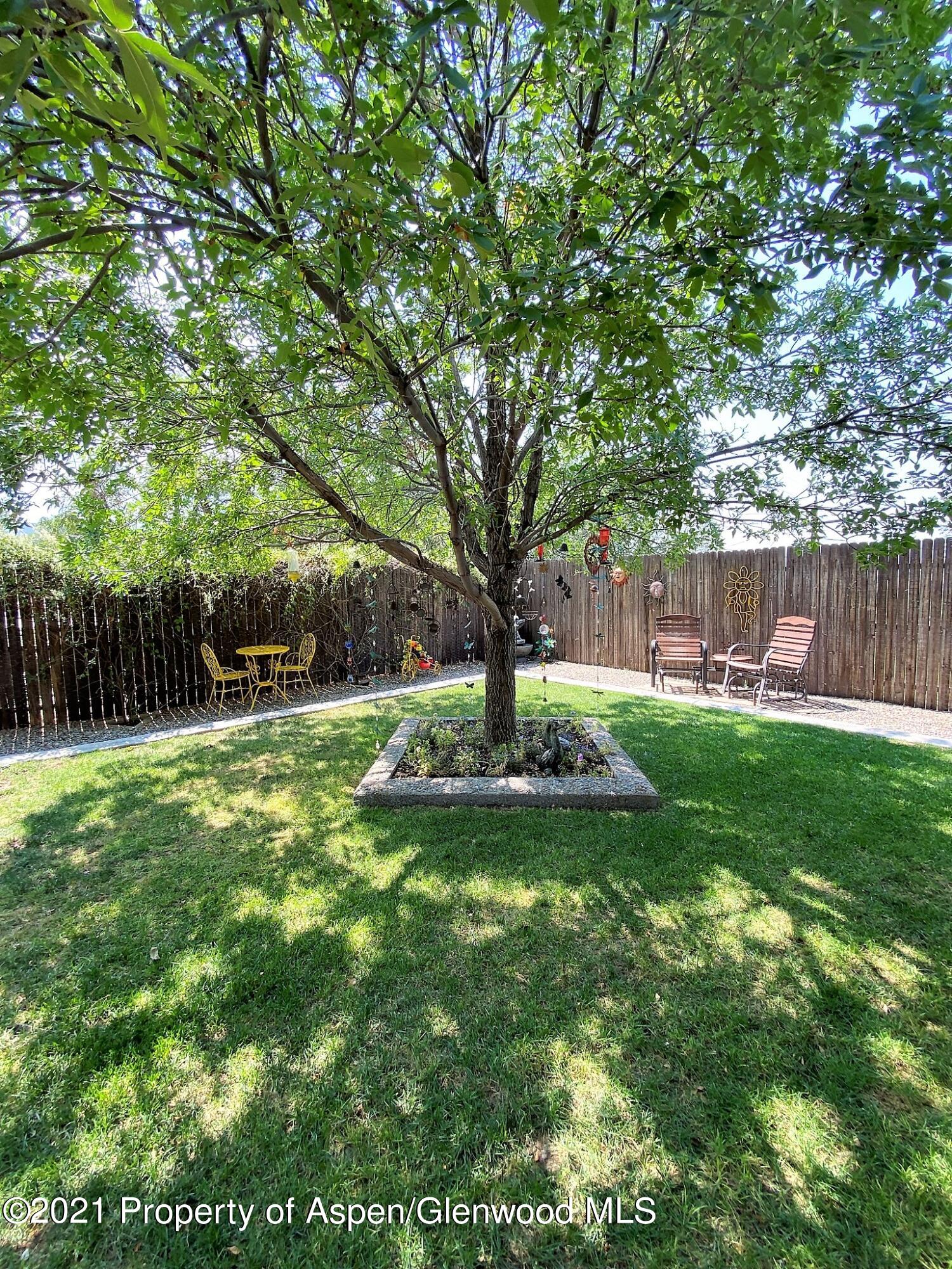 429 East 4th Street Rifle, CO 81650 - Photo 24 of 29 a view of a yard with a house in the background