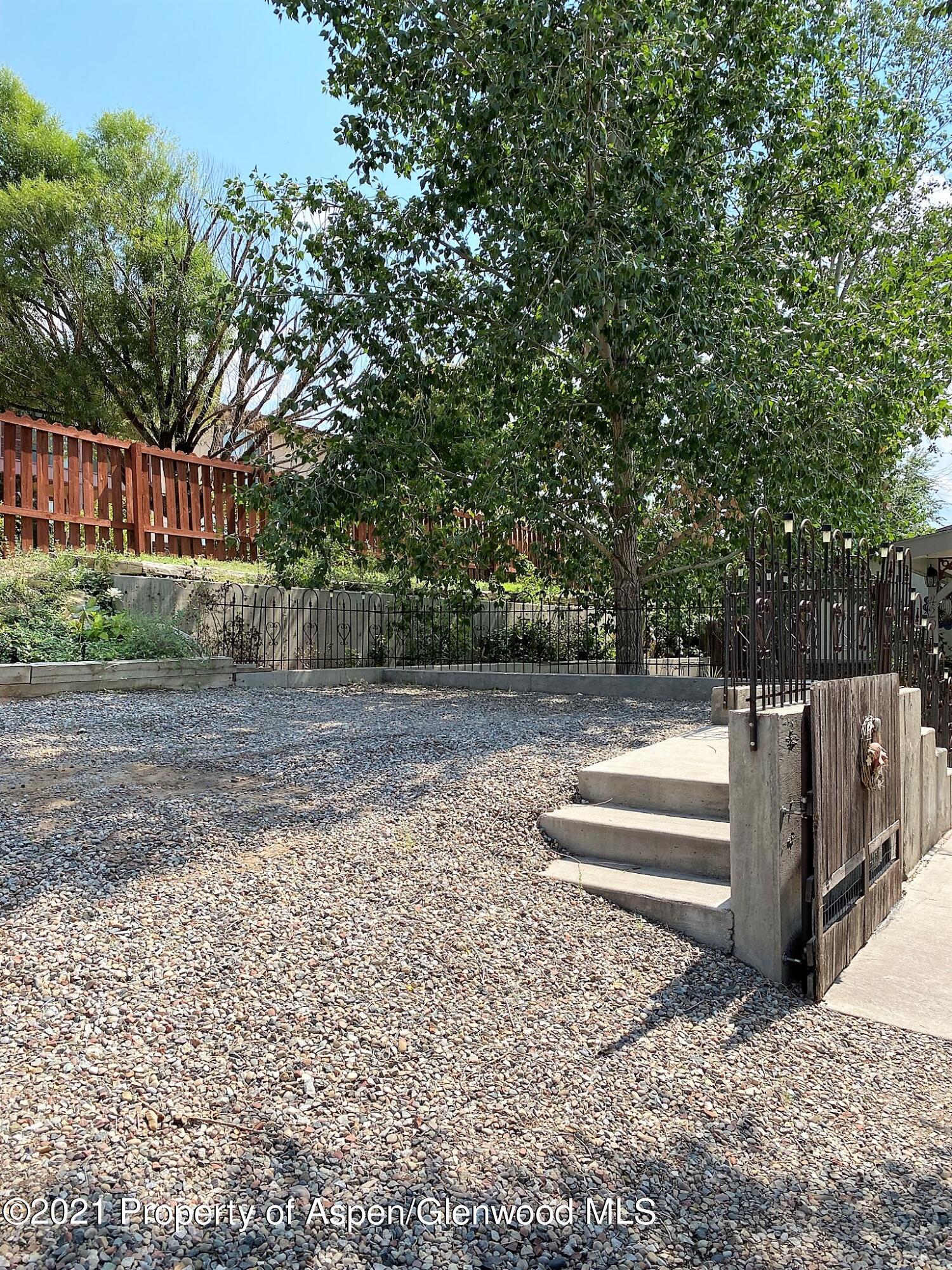 429 East 4th Street Rifle, CO 81650 - Photo 29 of 29 a view of backyard with deck and wooden fence