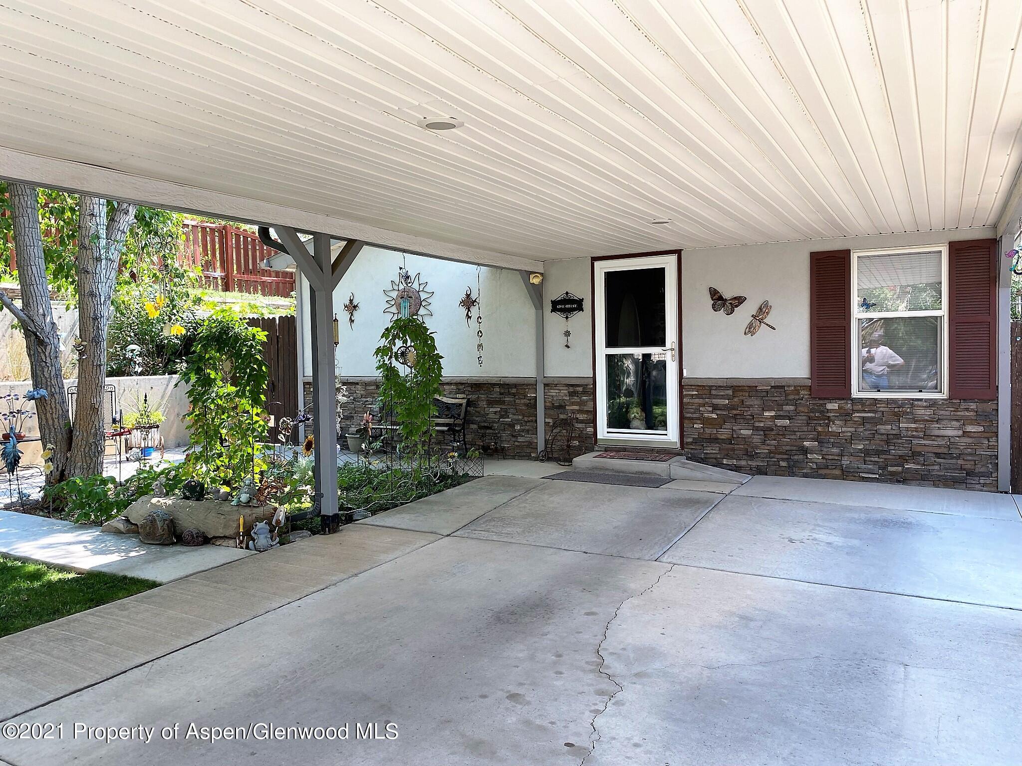429 East 4th Street Rifle, CO 81650 - Photo 3 of 29 a front view of a house with garden